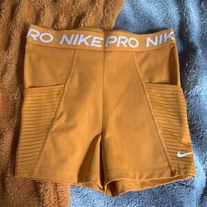 Nike Pro Women's Athletic Shorts Orange/yellow color, small, with pockets